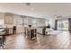 Spacious area featuring wood-look tile, combined living space, dining table and backyard access at 94 S 189Th Ln, Buckeye, AZ 85326