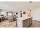 This combined living space includes a kitchen island, dining table, and open Gathering room at 94 S 189Th Ln, Buckeye, AZ 85326