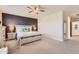 Spacious bedroom features a decorative accent wall and neutral color palette at 94 S 189Th Ln, Buckeye, AZ 85326