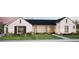 Charming two-story home with stone accents, a well-manicured lawn, and a glimpse of a vehicle in the garage at 9801 N 53Rd Pl, Paradise Valley, AZ 85253
