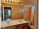Bathroom featuring double sinks, and shower/tub combo at 10399 E Hillery Dr, Scottsdale, AZ 85255