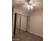 Bedroom closet featuring laminate flooring and sliding mirror doors at 10399 E Hillery Dr, Scottsdale, AZ 85255
