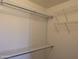 White wire shelving system in a closet with tan walls at 10399 E Hillery Dr, Scottsdale, AZ 85255