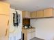Garage interior featuring cabinets, countertop and a modern tankless water heater for energy efficiency at 10399 E Hillery Dr, Scottsdale, AZ 85255