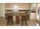 Cozy kitchen and eat-in nook area with a backyard view at 10399 E Hillery Dr, Scottsdale, AZ 85255