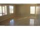 Bright living room with travertine flooring and large windows at 10399 E Hillery Dr, Scottsdale, AZ 85255