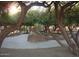 Community playground with a slide and climbing structure offers a fun and safe play area for children at 10399 E Hillery Dr, Scottsdale, AZ 85255