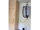 Wall-mounted water heater with a storage cabinet nearby at 10399 E Hillery Dr, Scottsdale, AZ 85255