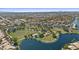 Scenic aerial view of a park featuring sports fields, a lake, and walking trails at 1135 W Sea Fog Dr, Gilbert, AZ 85233