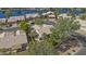 Aerial view of a waterfront home, lush landscaping, a private pool, and serene water views at 1135 W Sea Fog Dr, Gilbert, AZ 85233