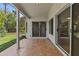 Covered patio with tiled flooring, offering a seamless transition to the outdoor space with large sliding glass doors at 1135 W Sea Fog Dr, Gilbert, AZ 85233