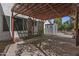 Outdoor patio with pergola, shed, concrete, and greenery makes for the perfect lounging spot in the backyard at 1135 W Sea Fog Dr, Gilbert, AZ 85233