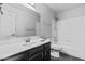 Clean bathroom with a single sink vanity, toilet, and shower/tub combo with neutral tones at 1135 W Sea Fog Dr, Gilbert, AZ 85233