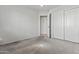 Bedroom featuring carpet floors, closet, and doorway, offering a comfortable and customizable space at 1135 W Sea Fog Dr, Gilbert, AZ 85233