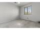 Bedroom featuring a window and carpet floors offering natural light, and a simple design at 1135 W Sea Fog Dr, Gilbert, AZ 85233