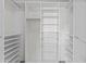 Organized walk-in closet boasts custom shelving and storage solutions, perfect for maximizing space and keeping items tidy at 1135 W Sea Fog Dr, Gilbert, AZ 85233