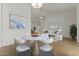 Well-lit dining area featuring hardwood floors, contemporary furnishings, and stylish decor at 1135 W Sea Fog Dr, Gilbert, AZ 85233