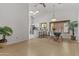 Open dining area with skylights, a ceiling fan, and breakfast bar seating at 1135 W Sea Fog Dr, Gilbert, AZ 85233