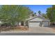 Inviting single-Gathering home with a three-car garage and well-maintained landscaping at 1135 W Sea Fog Dr, Gilbert, AZ 85233