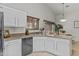 Bright kitchen features white cabinets, countertops, and stainless steel appliances at 1135 W Sea Fog Dr, Gilbert, AZ 85233
