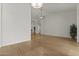 Spacious living room with wood floors, neutral paint, and ample natural light at 1135 W Sea Fog Dr, Gilbert, AZ 85233