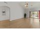 Bright living room with vaulted ceilings, archway, and sliding glass doors to the outdoor space at 1135 W Sea Fog Dr, Gilbert, AZ 85233
