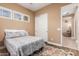 Comfortable bedroom featuring wood floor and attached closet and living area at 13720 N 148Th Dr, Surprise, AZ 85379