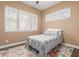 Cozy bedroom with great natural light, neutral walls and decorative rug at 13720 N 148Th Dr, Surprise, AZ 85379
