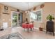 Eat-in kitchen area with a red tablecloth, elegant light fixture and natural light from the backyard sliding door at 13720 N 148Th Dr, Surprise, AZ 85379