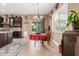Charming dining area with a stylish chandelier, perfect for enjoying meals with a view of the backyard at 13720 N 148Th Dr, Surprise, AZ 85379
