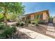 Charming single-story home with stone accents, desert landscaping, and a two-car garage at 13720 N 148Th Dr, Surprise, AZ 85379