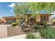 Charming single-story home with stone accents, desert landscaping, and a two-car garage at 13720 N 148Th Dr, Surprise, AZ 85379