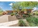 Charming single-story home with stone accents, desert landscaping, and a two-car garage at 13720 N 148Th Dr, Surprise, AZ 85379