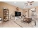 Cozy living area with a neutral color palette, tile floors, and built-in shelving, perfect for relaxation at 13720 N 148Th Dr, Surprise, AZ 85379