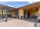 Outdoor patio area for entertaining, with cozy seating area and grill at 13720 N 148Th Dr, Surprise, AZ 85379