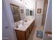 Bathroom showcasing a double sink vanity, walk-in shower with decorative tile, and a clean design at 16021 N 30Th St # 127, Phoenix, AZ 85032