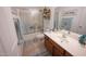 Cozy bathroom featuring a vanity, tiled floor, and shower with sliding glass doors at 16021 N 30Th St # 127, Phoenix, AZ 85032