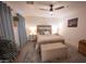 Bedroom with a neutral color scheme, blue drapes and carpet at 16021 N 30Th St # 127, Phoenix, AZ 85032
