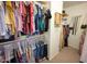 Spacious walk-in closet featuring built-in shelving and ample hanging space for clothes and accessories at 16021 N 30Th St # 127, Phoenix, AZ 85032