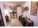 Bright dining area with modern bar, wine rack and view of kitchen in background at 16021 N 30Th St # 127, Phoenix, AZ 85032
