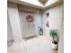 Charming entryway featuring a security door, decorative wreath, and potted plant at 16021 N 30Th St # 127, Phoenix, AZ 85032