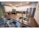 Well-lit kitchen featuring modern appliances, including a stainless steel fridge and ample counter space at 16021 N 30Th St # 127, Phoenix, AZ 85032