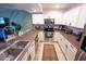 Spacious kitchen with stainless steel appliances, white cabinets, and a stylish rug at 16021 N 30Th St # 127, Phoenix, AZ 85032