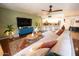Inviting living room featuring a large sectional sofa, modern decor, and an open layout to the kitchen at 16021 N 30Th St # 127, Phoenix, AZ 85032
