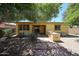Spacious backyard with a built-in grill, covered patio, and low-maintenance landscaping at 16528 W Lariat Ln, Surprise, AZ 85387