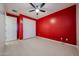 Bedroom features new floors, closet, and a ceiling fan at 16528 W Lariat Ln, Surprise, AZ 85387