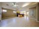 Spacious open floor plan featuring a kitchen with an island and fireplace at 16528 W Lariat Ln, Surprise, AZ 85387