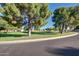Inviting community park with expansive green space and mature trees, perfect for outdoor enjoyment at 17830 N 45Th Ave, Glendale, AZ 85308