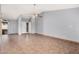 Spacious living room with tile floors, ceiling fan, and ample natural light at 17830 N 45Th Ave, Glendale, AZ 85308
