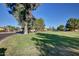 Scenic neighborhood with lush greenspace, mature trees, and well-maintained lawns, creating a serene environment at 17830 N 45Th Ave, Glendale, AZ 85308